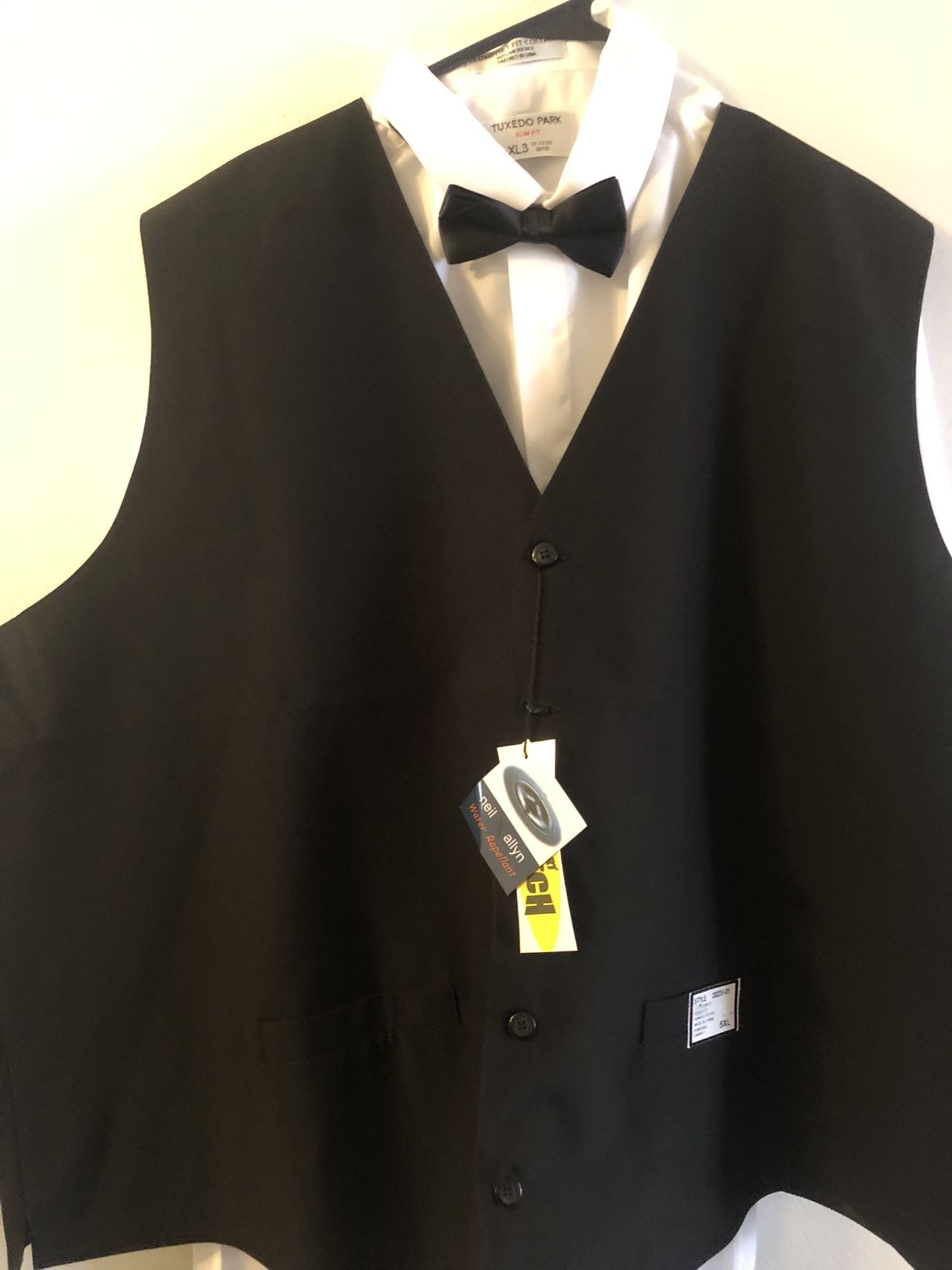 Neil Allyn Black Polyester Catering and Servers Vest. Brand New with Tags. Mens Sizes Med, Large, XL,3XL, and 5XL. Includes Black Bow Tie.