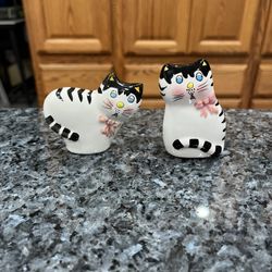 Vintage ceramic Black & White Kitty Cat with Pink Bow Pair of salt and pepper shakers. Size approximately tallest 2 3/4 inches tall. Brand new never