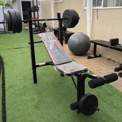 Gym Equipmentt bench press with 100lb weight set Combo With leg extension