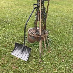 Garden and winter snow, shovel hose, and hedge trimmer