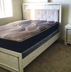 Queen size bed with mattress and dresser