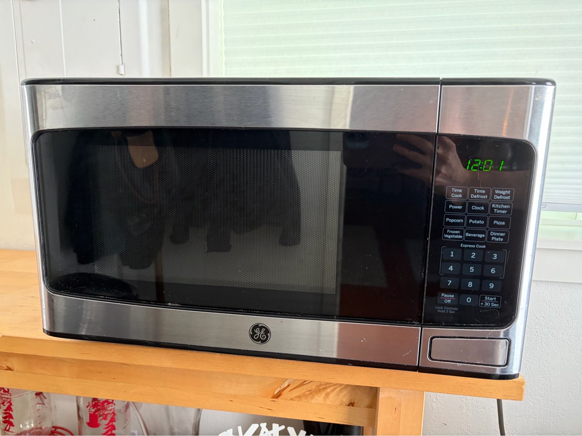 GE 1.1 Cu. Ft. Countertop Microwave Oven (Model JES1145SHSS)