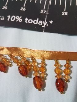 Beautiful beaded fringe. 33 inches long. Exellent to decorate bath towels.