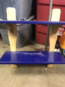 Baseball bat shelf