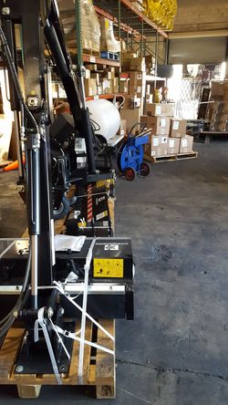 Articulated boom mower skidsteer