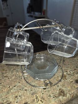 Glass cups with saucers and stands