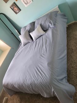 Full IKEA white wood frame bed with matress.