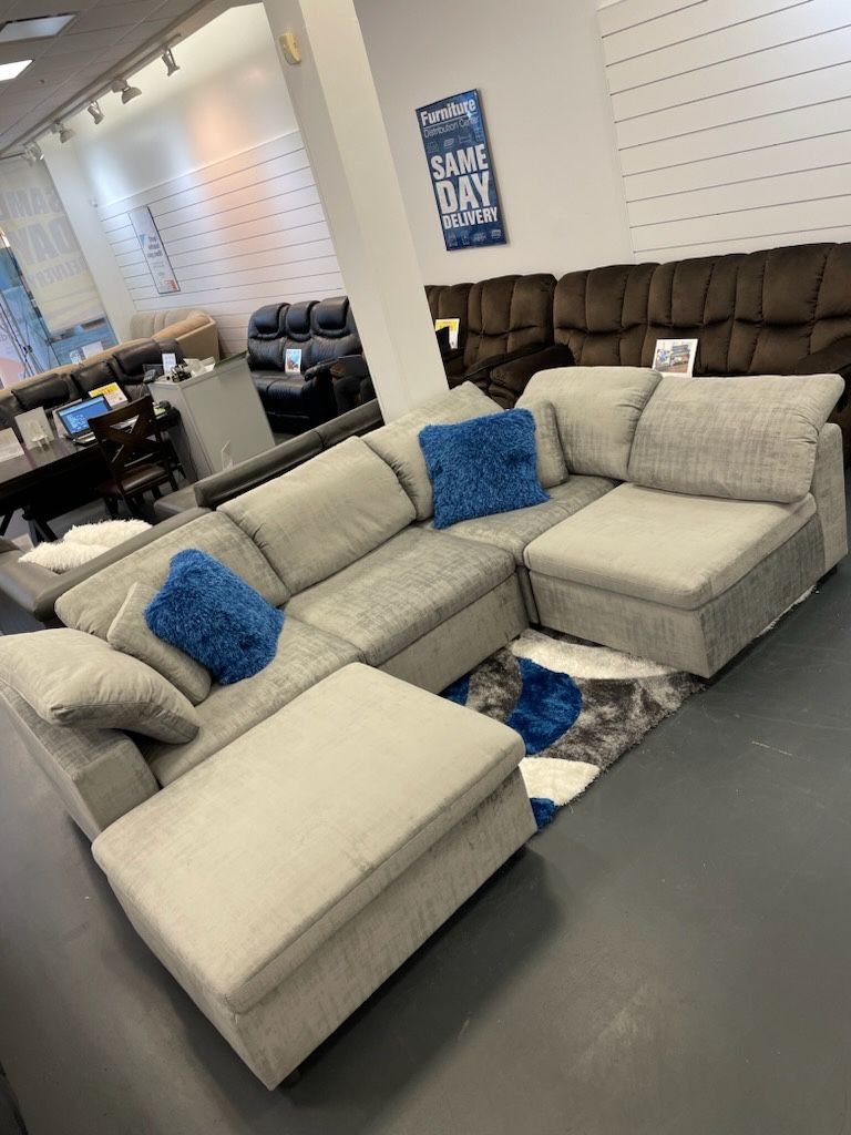 ONLY $899 LIMA SECTIONAL AND OTTOMAN SET 