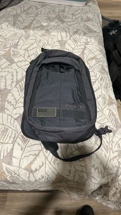 Vertx commuter sling bag  in grey