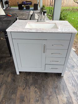 Gray Bathroom Vanity with Marble Top and Sink