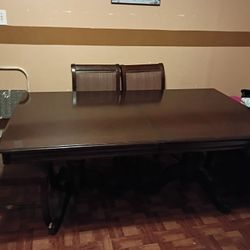 Solid Wood Table With 4 chairs and 2 captains Chairs