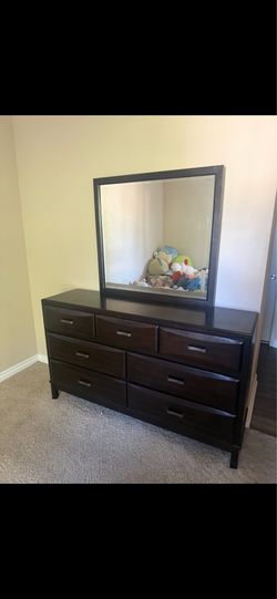 Dresser with attached body mirror