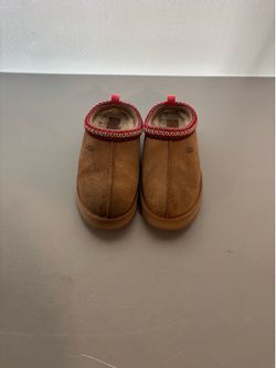 Kids' UGG Tazz slip-on, size 4, in great condition.