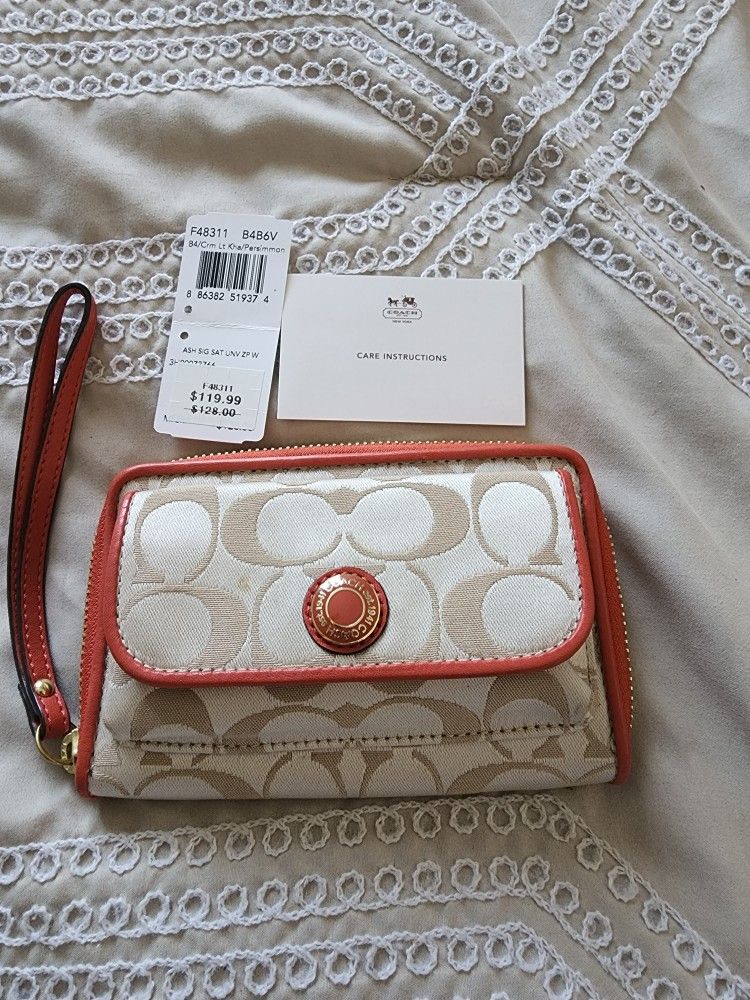 Authentic coach wristlet wallet in khaki and persimmon