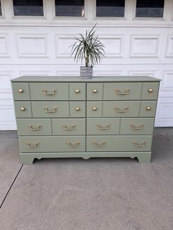 Beautiful sage green dresser with gold hardware