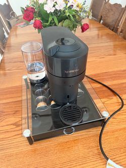 Nespresso machine with pod holder