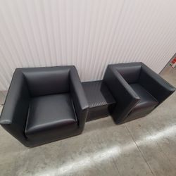 Two Leather Chairs 