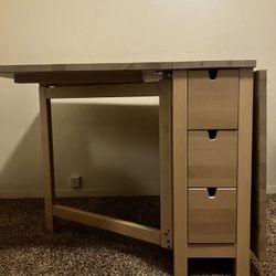 IKEA gate-leg table. Great storage and functional for small spaces. 