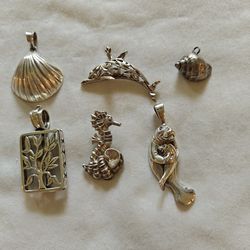 Sterling silver pendants marked