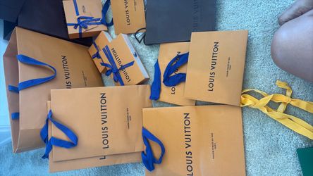 Various authentic Louis Vuitton bags and boxes