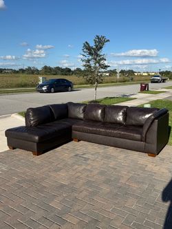 Real leather Sectional couch. Delivery available