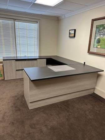 Executive Office Set Up. Large height adjustable desk. Task chair. Side chairs. Table.