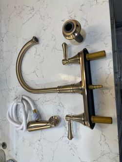 Delta Two Handle Kitchen Faucet with Spray in Champagne Bronze