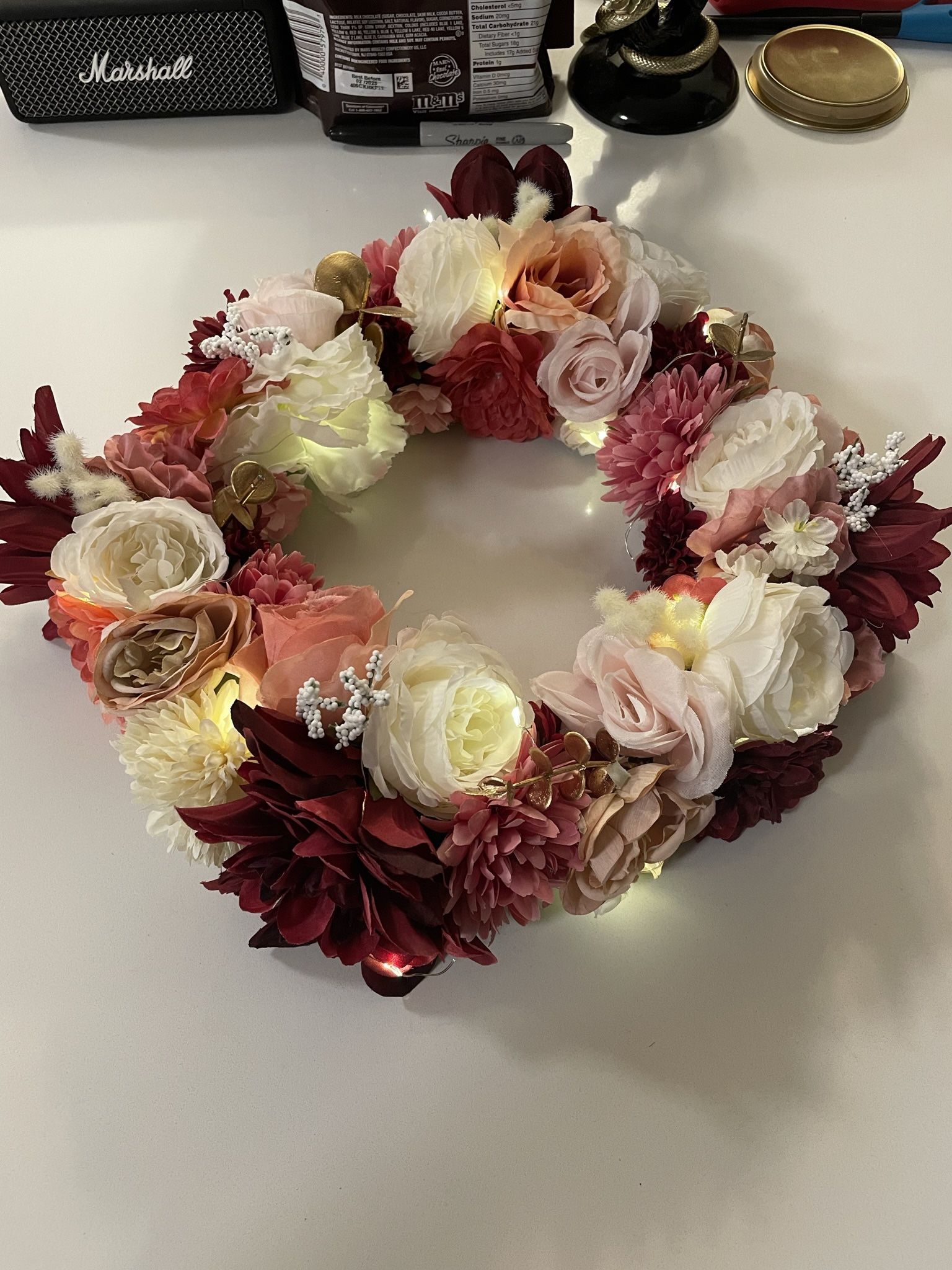 Artificial Floral Centerpieces included round mirror, vase, and fairy lights
