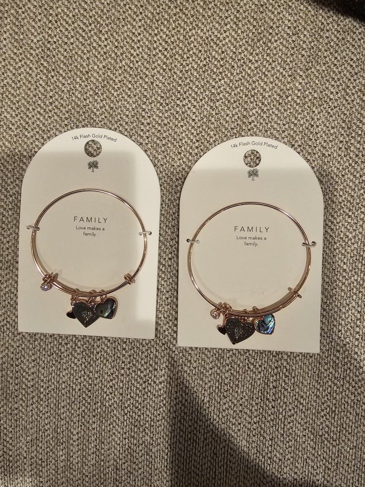 New 14k flash gold plated "Love makes a family bracelet". $10 each or both for $15