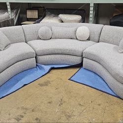 Brand New Gorgeoues Curved Sectional upholstered in performance Boucle fabric. pillows included