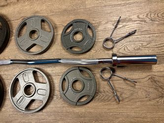 BRAND NEW: Olympic Curl Bar with Cooper Bearing Mech & Three Grip Cast Iron Weight Plates 25s, 10s and 5s. Total: 100 lbs