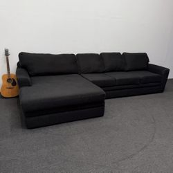 Oversized Prestiged Black Sectional Couch. In good condition. We deliver & setup.
