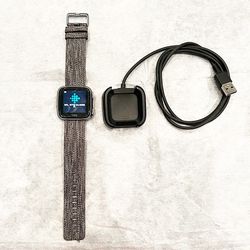 Impeccable Fitbit Versa Health and Fitness Smartwatch with Charger