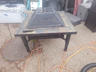The price is firm.. large mosaic tile top fire pit