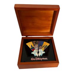 Disney’s NIB 4 Parks in One World Pins.  Limited Edition Pin Set in Wooden Box.  These pins represent each of the parks. Excellent condition  KS 