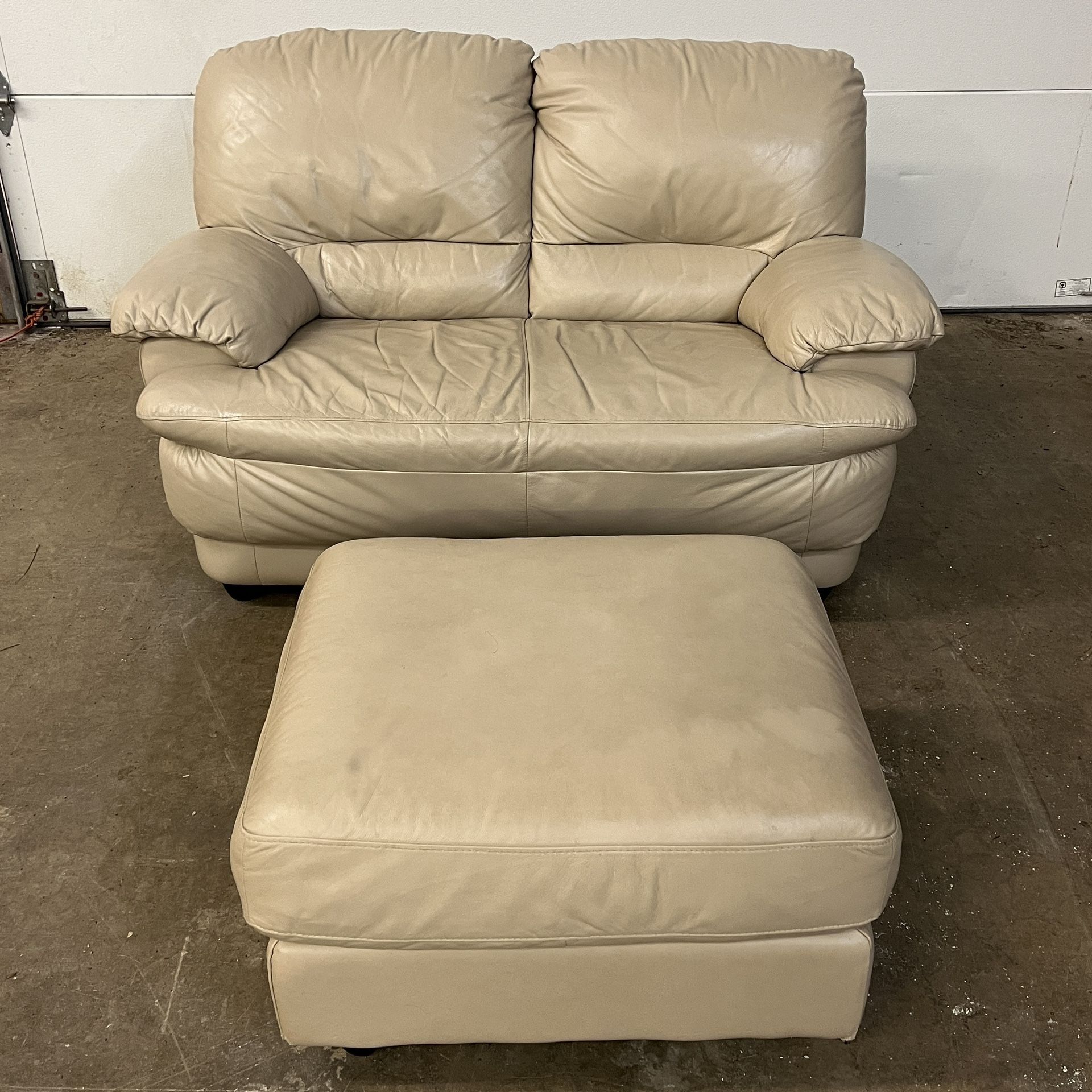Beige Leather Loveseat and Ottoman. Sofa $150. Footstool $50. Sold Separately. Free to ask, I reply.