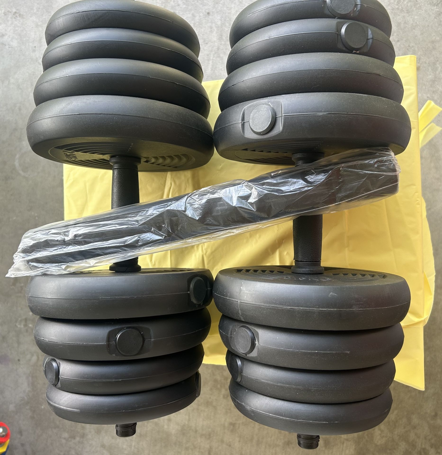 66 pounds dumbbells 33 pounds each one they come with an extra bar so you can make your bar longer and work out and your chest