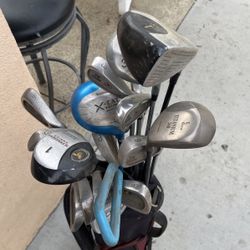 Various Golf Clubs And Bag