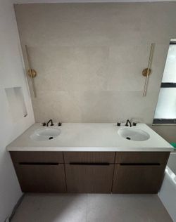 Wood Vanity with stone counter and sinks