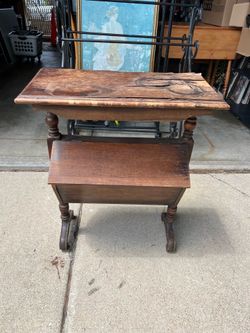 Antique farmhouse sewing table with storage