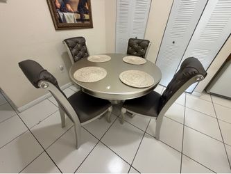 Round dining table and chairs.