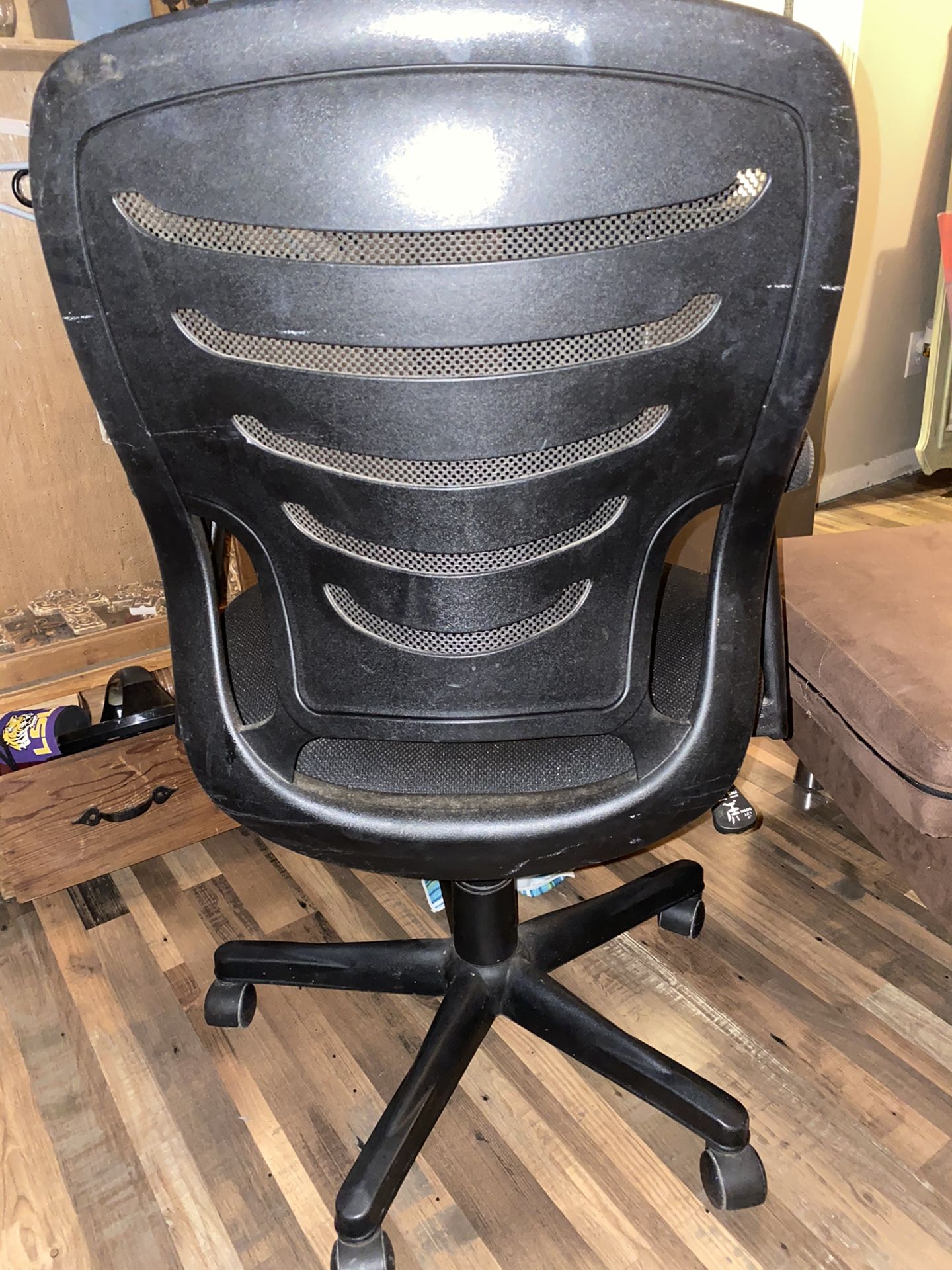 Office chair has a little wear and tear on the seat but very comfortable chair and functional