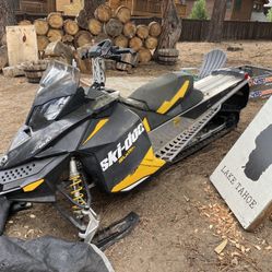 2 Running Snowmobiles