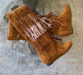 Pair of brown Boots under knee