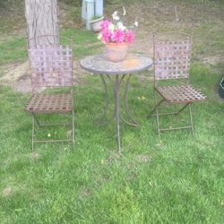 Two Chairs And Table Outside