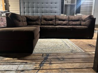 Large brown sectional couches