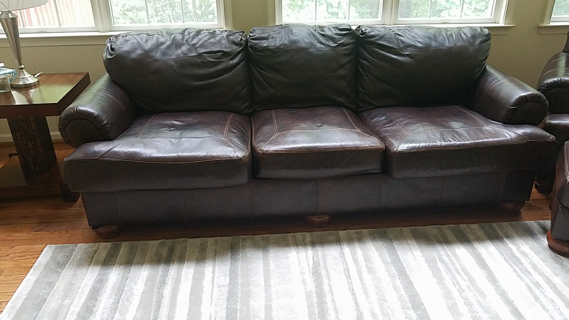 Dark brown leather couch w/ oversized chair