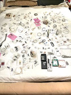 Huge collection of brand new never worn gold, plated, and silver plated jewelry. Over $2000 worth.