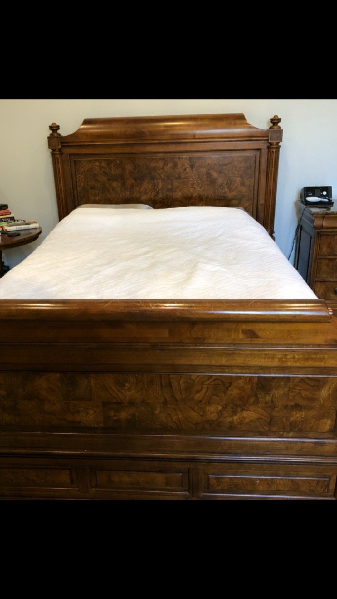 Wood frame bed.