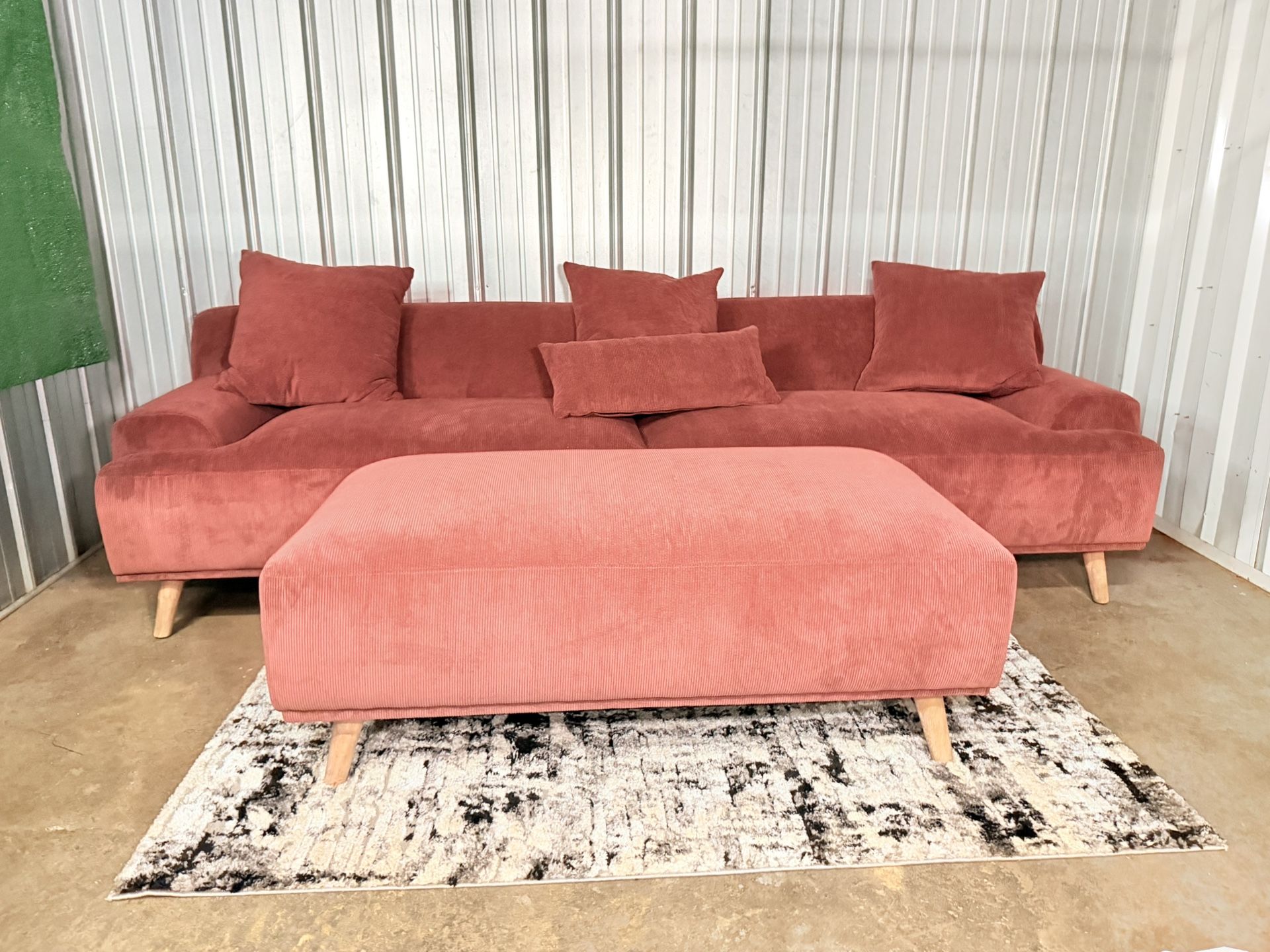 Beautiful modern 3-seater pink sofa with ottoman
